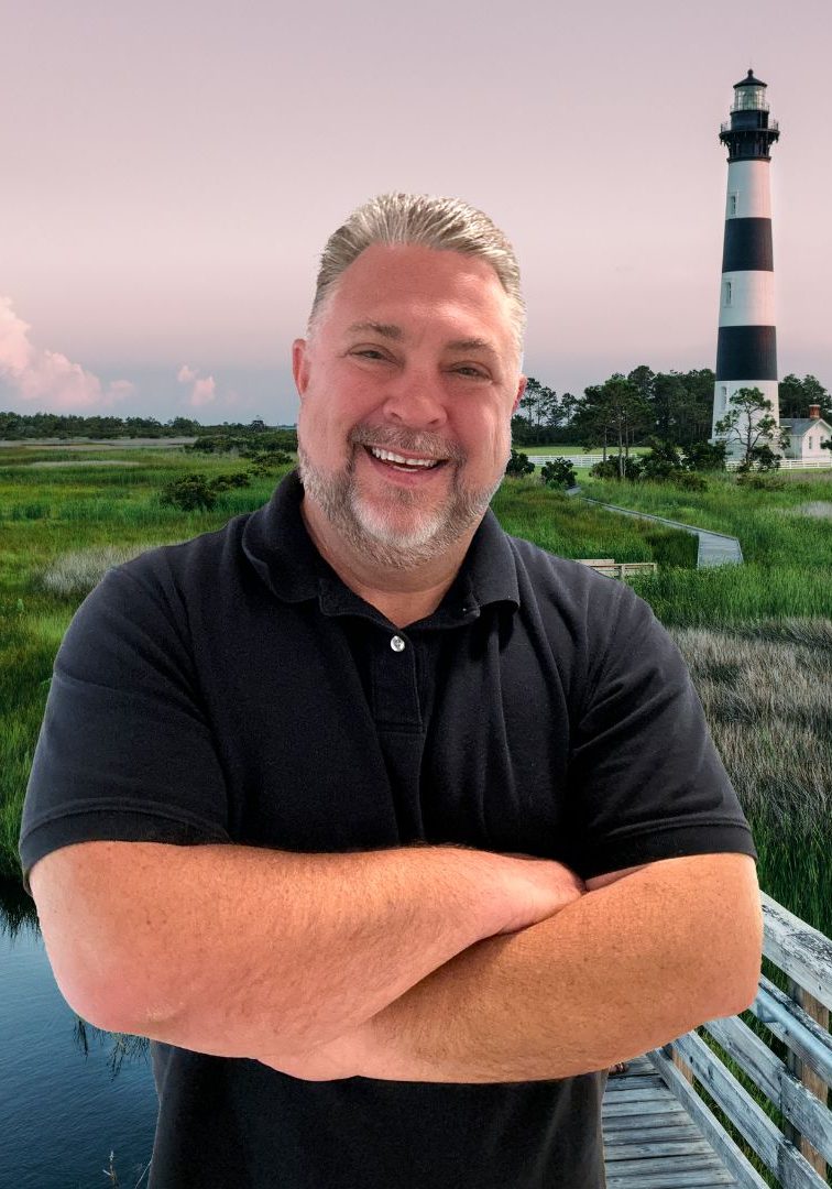 Jason standing in front of the Bodie Island Light